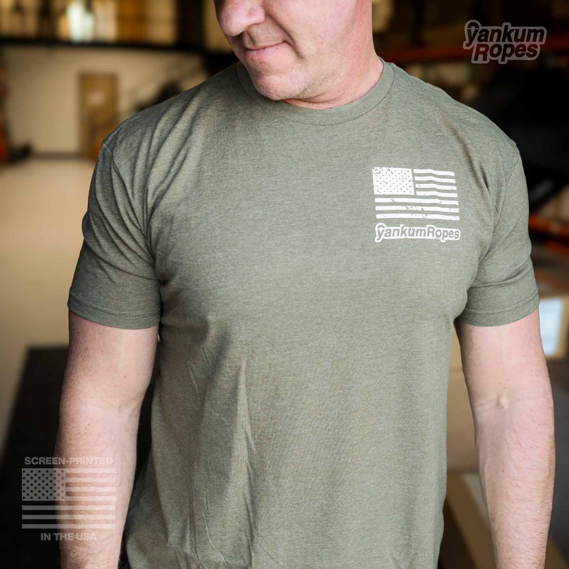 view of the front of the green Yankum Join or Die Tee